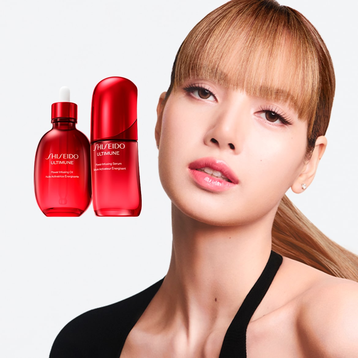 Objavte Shiseido Ultimune Power Infusing Oil a Serum v červenom balení, ktoré aktivujú energiu pleti, spolu s portrétom modelky s prirodzeným make-upom.