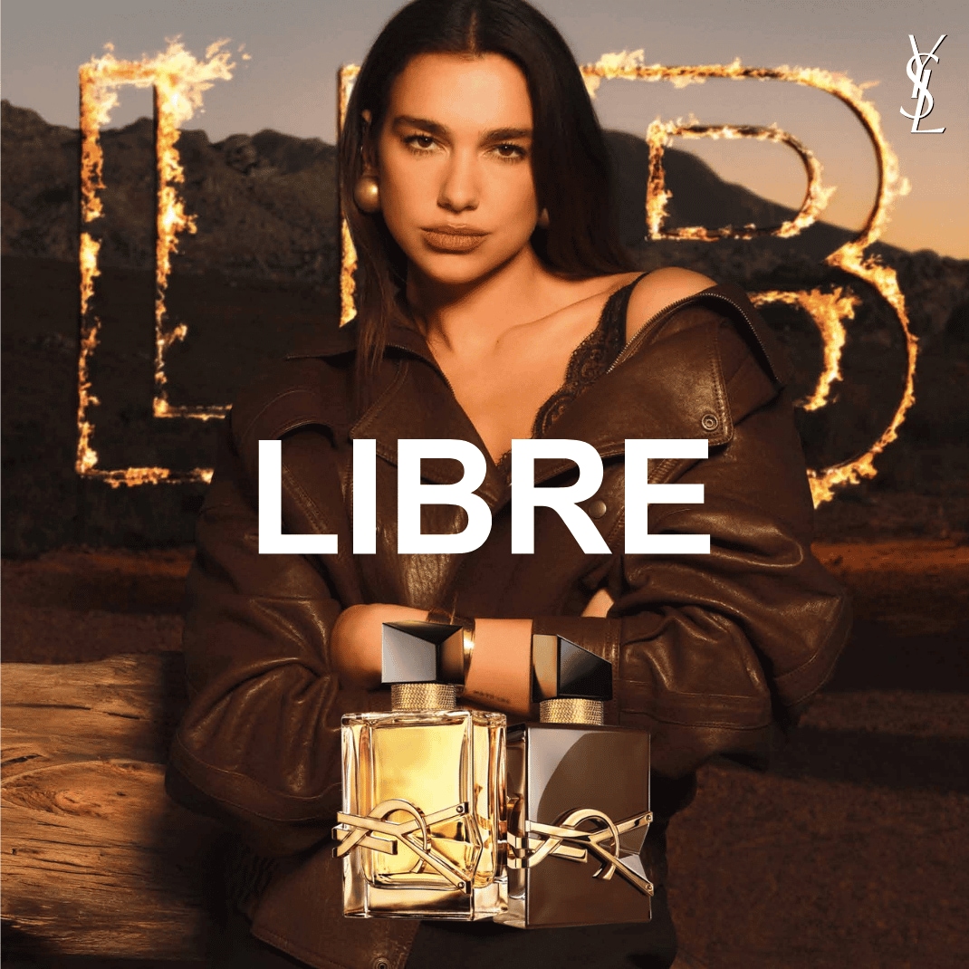 Dua Lipa predstavuje parfumy Libre od YSL, pričom v pozadí horia písmená L a B, a v popredí sú dva flakóny Libre, jeden so zlatou tekutinou a druhý s tmavou tekutinou.